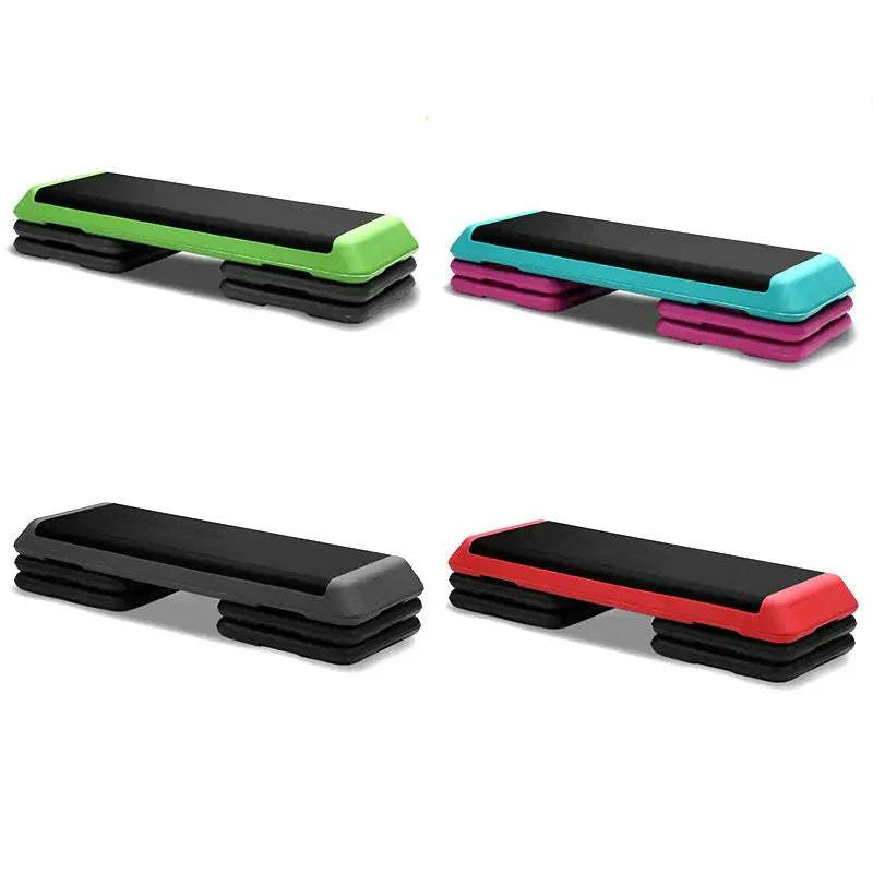 Fitness step board in green, red, and gray for aerobics and exercise workouts.