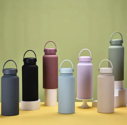 Steel Sport Max stainless steel sports kettles in various colors, featuring a sleek design and easy-carry handles.