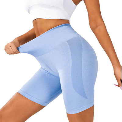 Women's yoga shorts in Catharanthus Roseus color, showcasing flexible fit and elastic waistband.