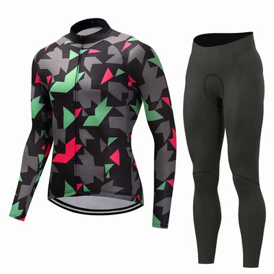Cycling jersey and long pants set with abstract pattern in black, green, and pink.