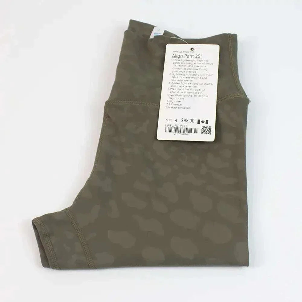 High Waist Hip Lift trousers in light grass color, folded with tag attached, showcasing premium nylon and Lycra fabric.