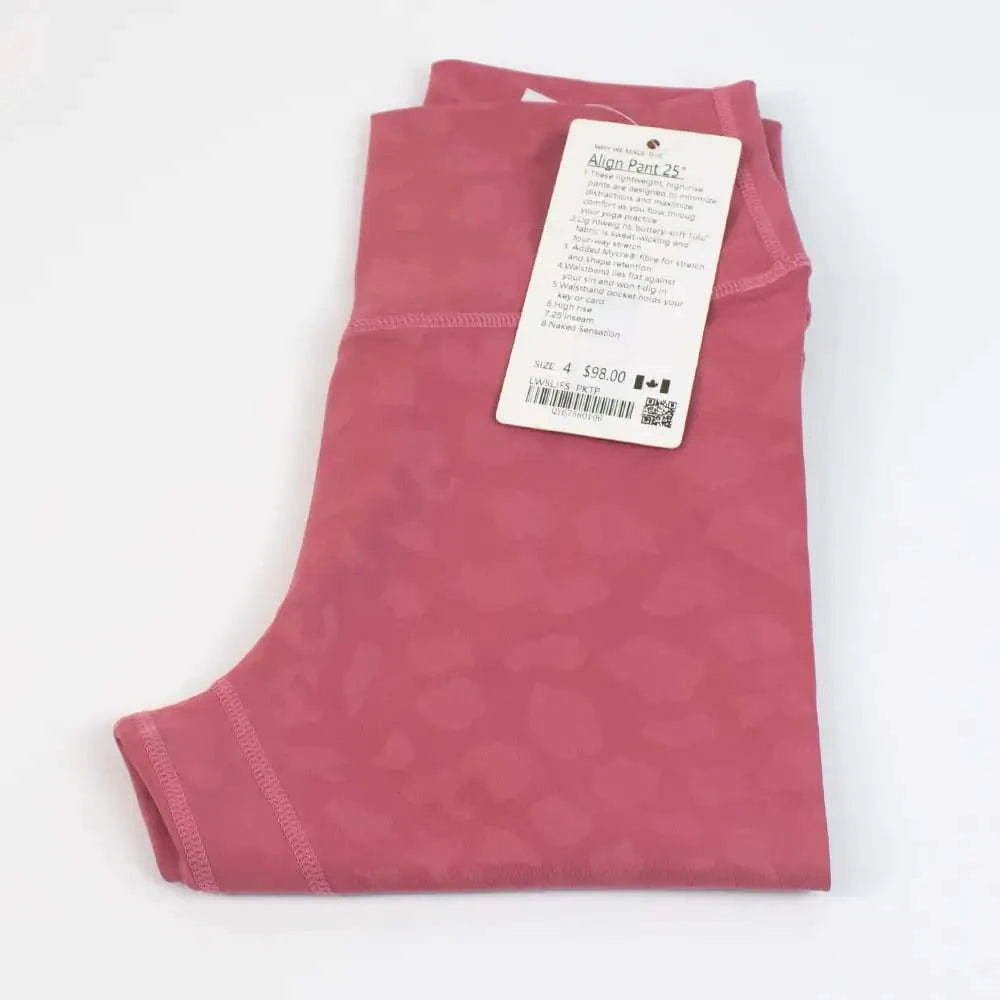 High Waist Hip Lift trousers in rose color folded with tag displayed.