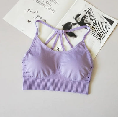 Violet sport bra for fitness and yoga with stylish back design.