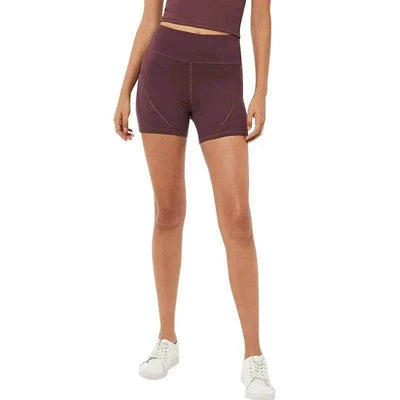 Quick-Dry high-waisted sports shorts in dark purple, form-fitting with cotton blend fabric, showcasing leg movement.