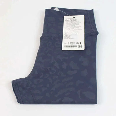 High Waist Hip Lift trousers in graphite gray, folded with a tag attached.
