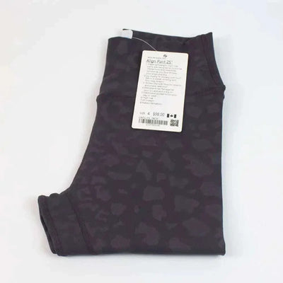 High Waist Hip Lift trousers folded with tag displaying details.