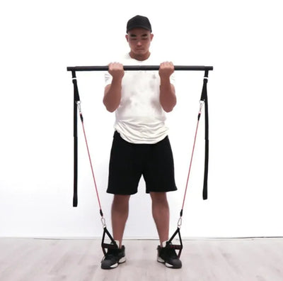 Pilates Bar Kit with resistance bands used for home workout.