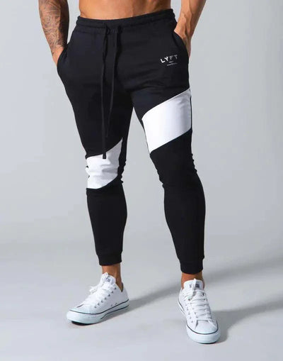 Trendy men's slim fit casual exercise trousers in black with white accents, showcasing a stylish and comfortable design ideal for workouts and leisure activities.
