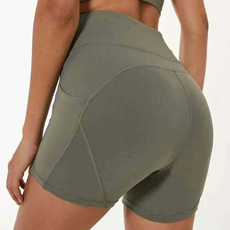 Moss green quick-dry high-waisted sports shorts in cotton blend fabric.